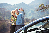 Senior couple taking self-portrait