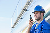 Worker using walkie-talkie