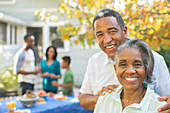 Smiling senior couple at barbecue