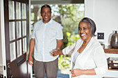 Smiling senior couple holding hands