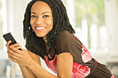 Close up Smiling woman holding cell phone