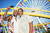 Senior couple taking selfie