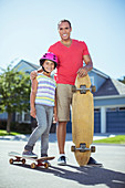 Father and daughter with skateboards