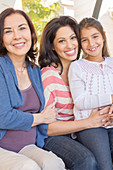 Smiling multi-generation women