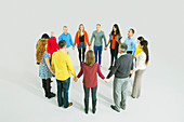 Business people holding hands in circle