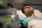 Male patient lying in hospital bed