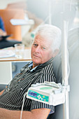 Senior man receiving intravenous infusion