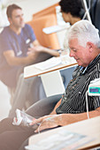 Senior man receiving intravenous infusion