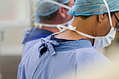 Doctors wearing surgical caps