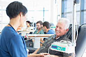 Senior patient talking to doctor