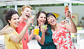 Women cheering together at party