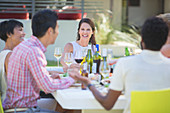 Friends relaxing together at table