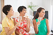 Women drinking wine together