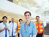 Doctors, nurses and paramedics smiling