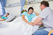 Man talking to wife in hospital
