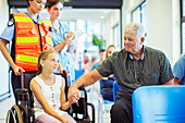 Man holding granddaughter's hand