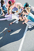 People rushing to injured girl on street