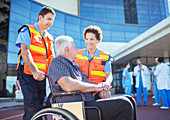 Paramedics talking to patient