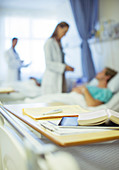 Close up of books on hospital bed tray