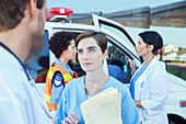 Doctor and nurse talking outside hospital