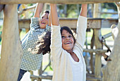 Children climbing on monkey bars