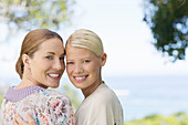 Smiling women hugging indoors