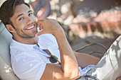 Smiling man relaxing outdoors