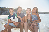 Family sitting together in waves