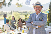 Older man enjoying picnic with family