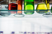 Close up of beakers on shelf