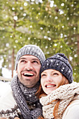 Couple admiring snow together
