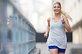 Woman running through city streets