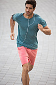 Man running through city streets