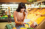 Woman talking on cell phone and shopping