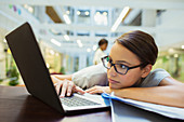 Businesswoman relaxing with laptop