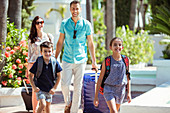 Family with suitcases