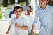 Smiling boy and girl running