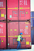 Worker opening cargo container