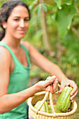 Young woman carrying basket