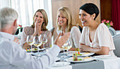 People enjoying meal in restaurant