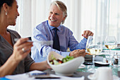 Smiling business people having lunch