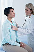 Female doctor examining her patient