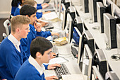 Teenage students using computers