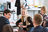 High School students sitting and smiling