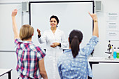 Students with their teacher in school lab