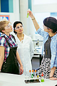 Teacher and students in chemistry lesson
