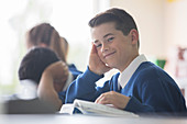 Elementary school boy sitting at desk