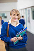Student wearing school uniform standing