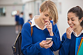 Students looking at mobile phone