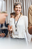 Businesswoman holding champagne flute